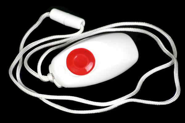 Hand holding a Safesound Personal Alarm system